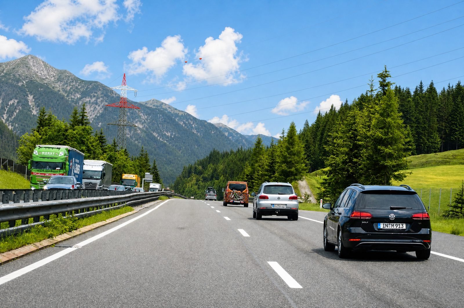Cars and trucks on an alpine motorway
