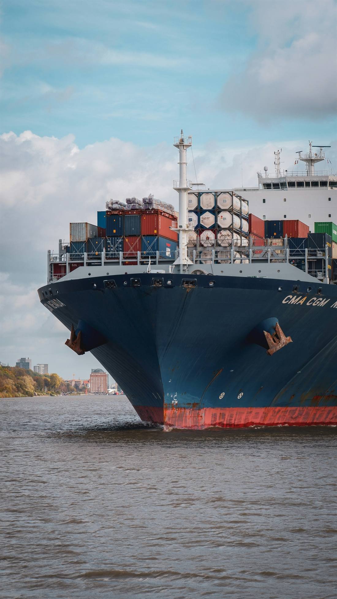 Container ship under way on the river