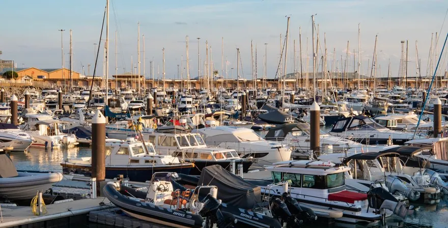 Moored boats resting in a calm harbour over the off-season